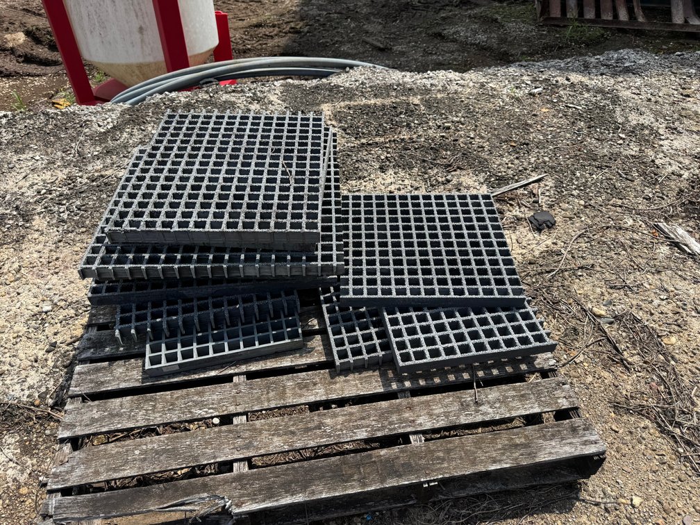 Multiple Gray Fiberglass Molded Grating Panels