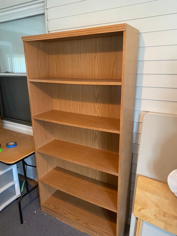 Pressed wood style bookshelf with adjustable shelves