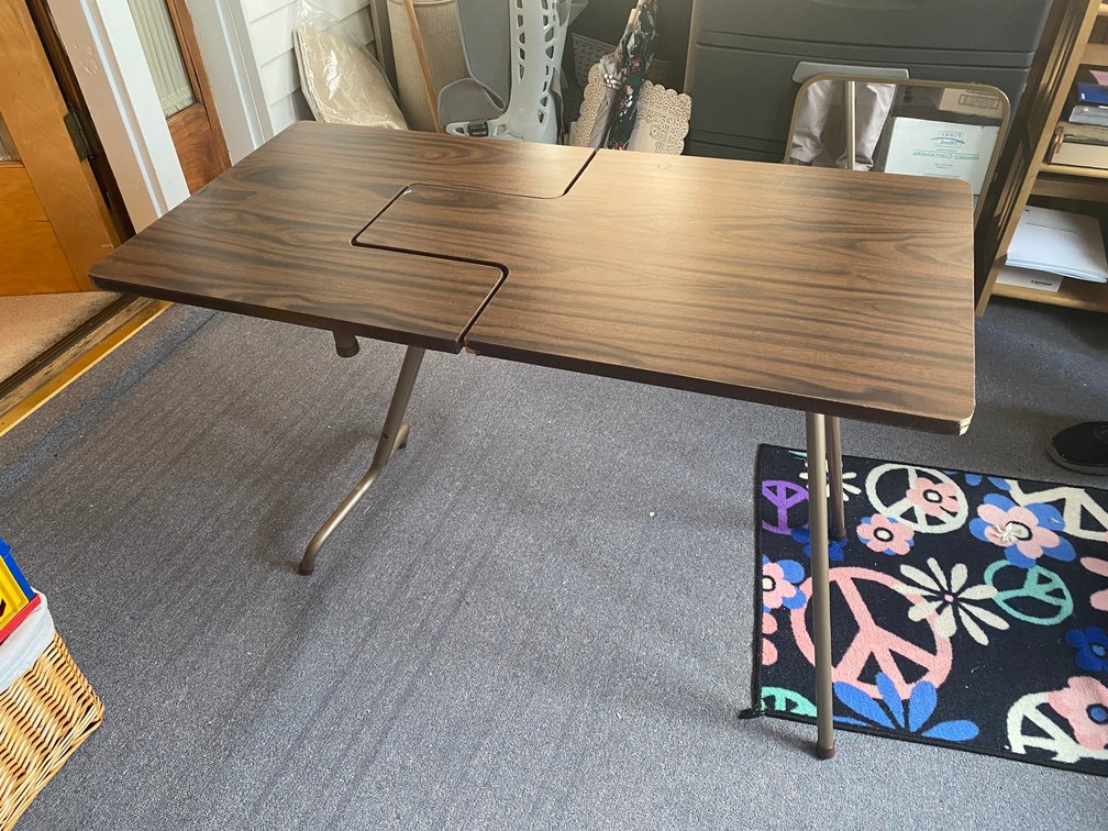 Folding table for sewing machine
