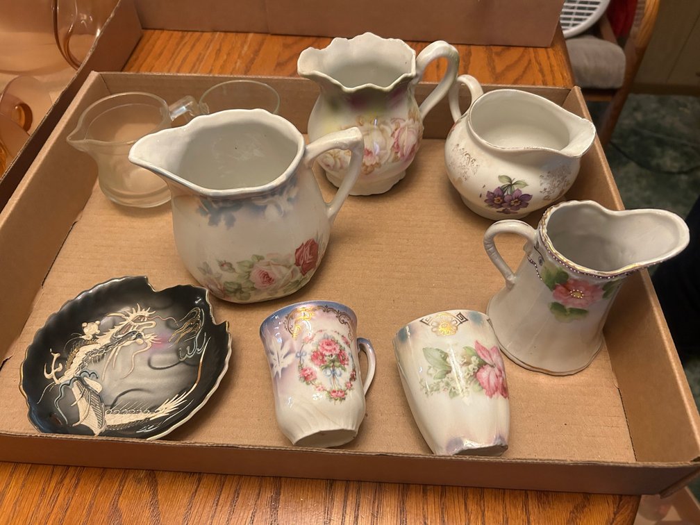 Dragonware plate, floral pitchers and creamers