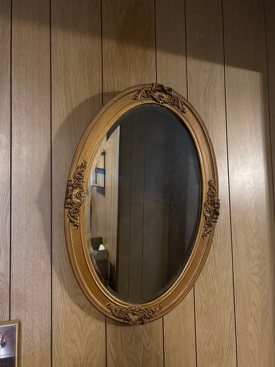 Antique beveled mirror, oval frame