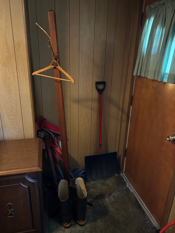 Hall tree, folding chair, snow shovel, fireman's boots