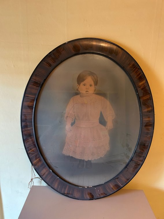 Vintage oval framed baby photograph