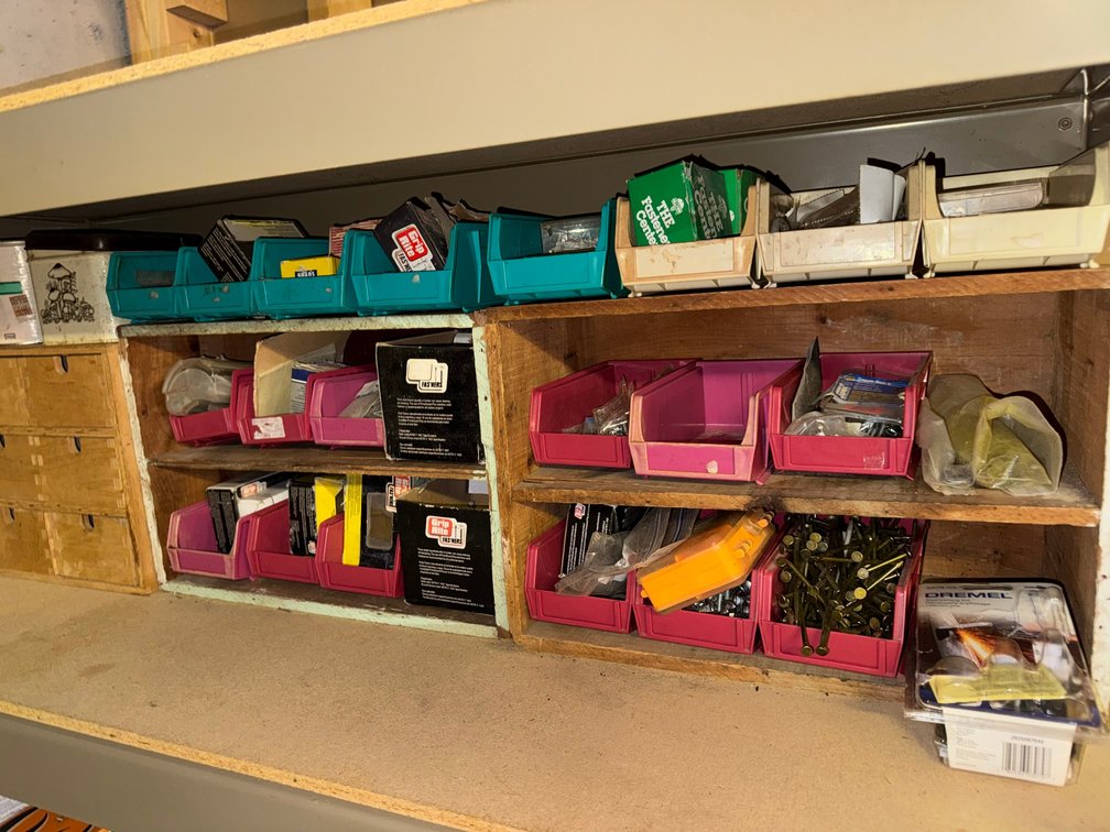 Storage bins including a variety of red and blue plastic bins