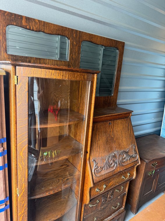 Antique oak side by side secretary desk with curved glass curio cabinet and ornate mirror