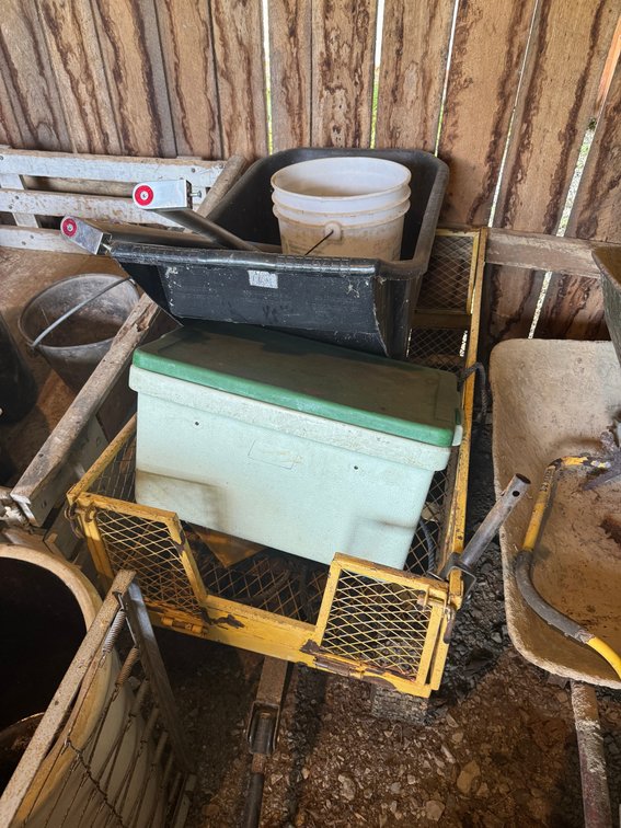 Yellow mesh sided metal wagon