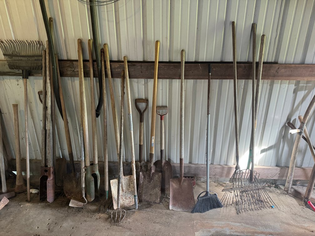 Mix of shovels, spades and post hole diggers