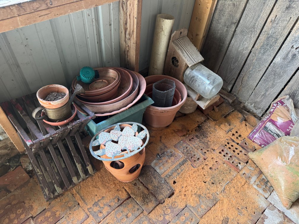 Metal Storage Unit with Garden Supplies