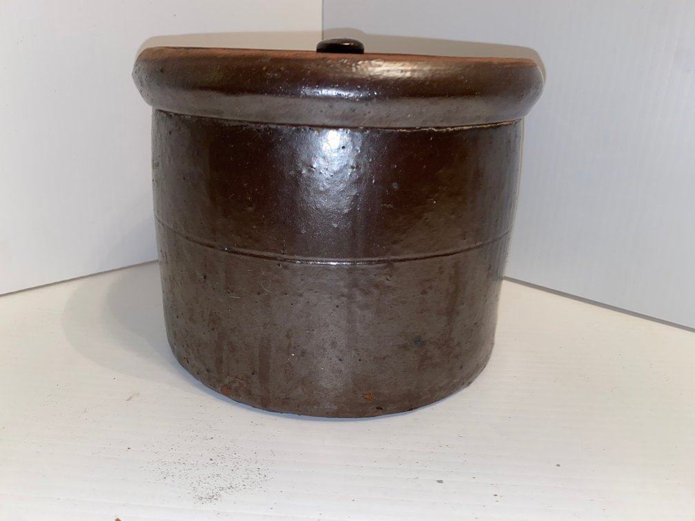 Heavy brown glaze ceramic or stoneware brown crock with lid