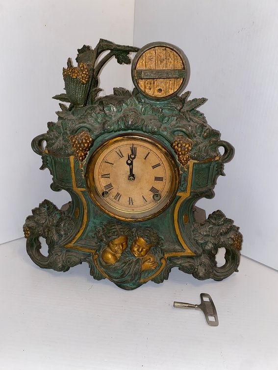 Antique Victorian mantle clock-features ornate cast metal case