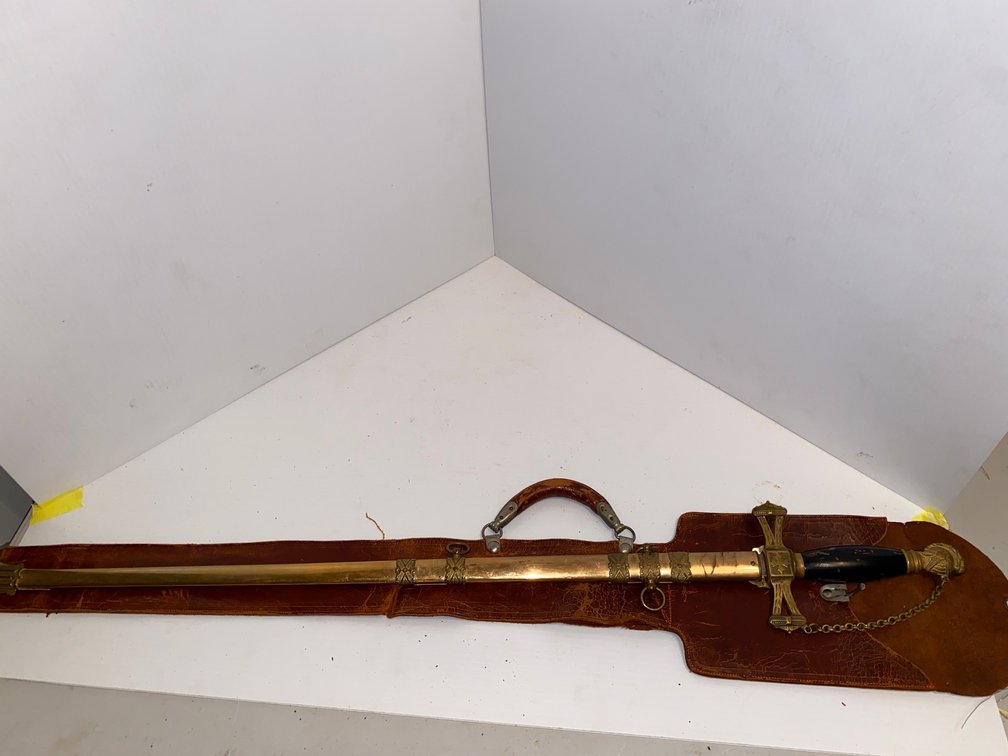 Engraved sword in leather case