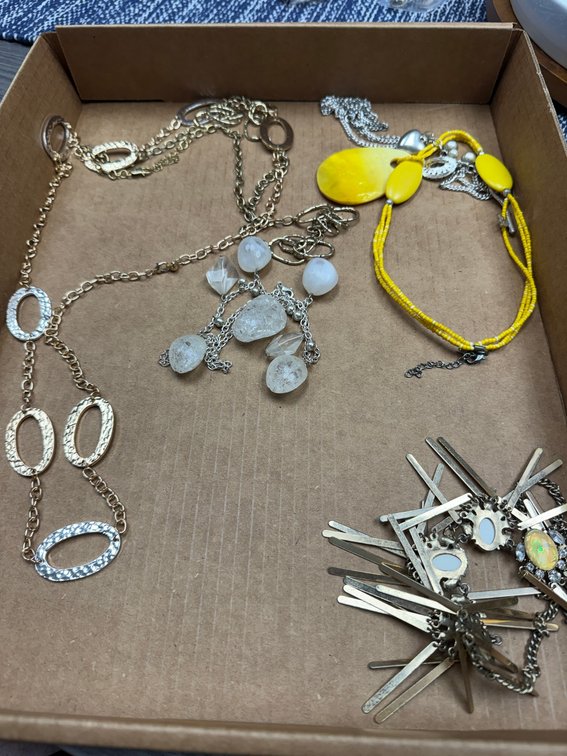 Variety of metal necklaces, bracelets