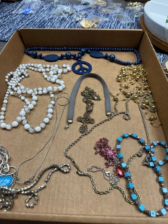 Variety of beaded necklaces, metal necklaces, chains