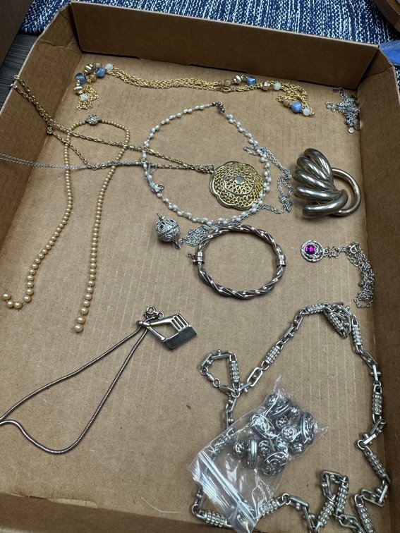 Variety of pearl necklaces, metal chains