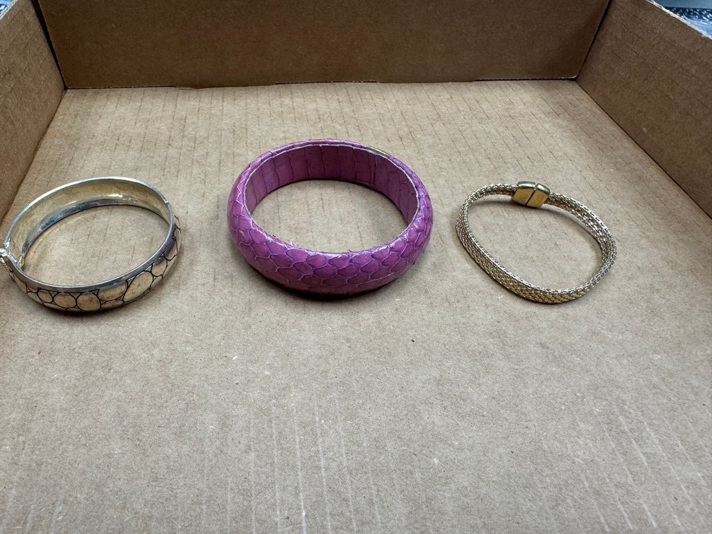 silver and purple bracelets