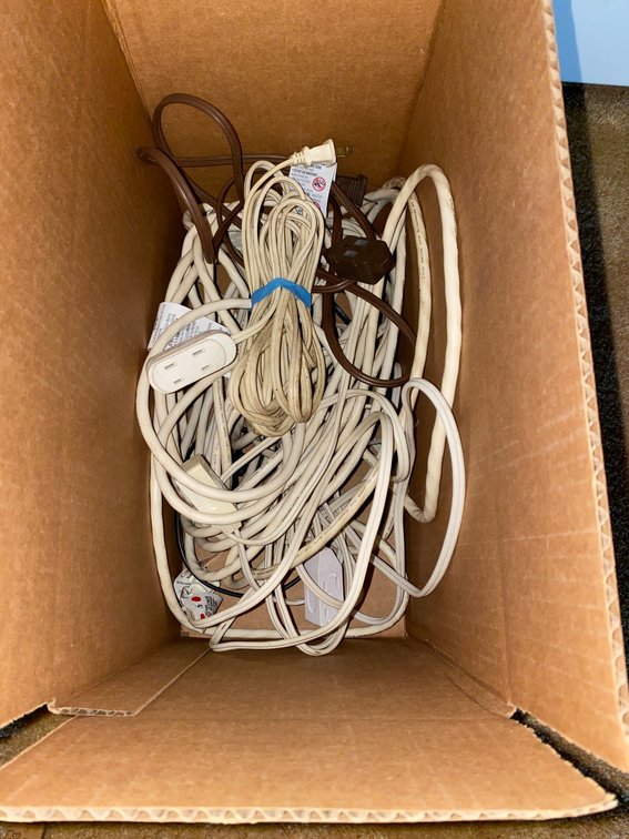 Box with several extension cords