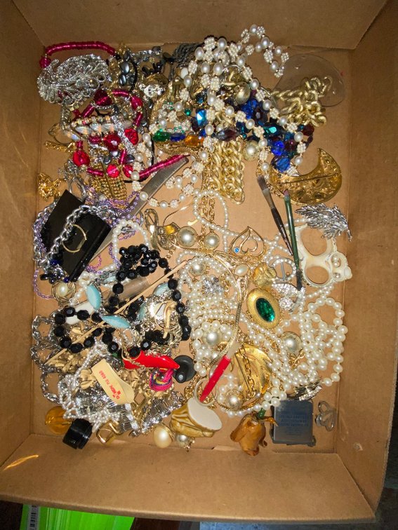 Flat of costume jewelry