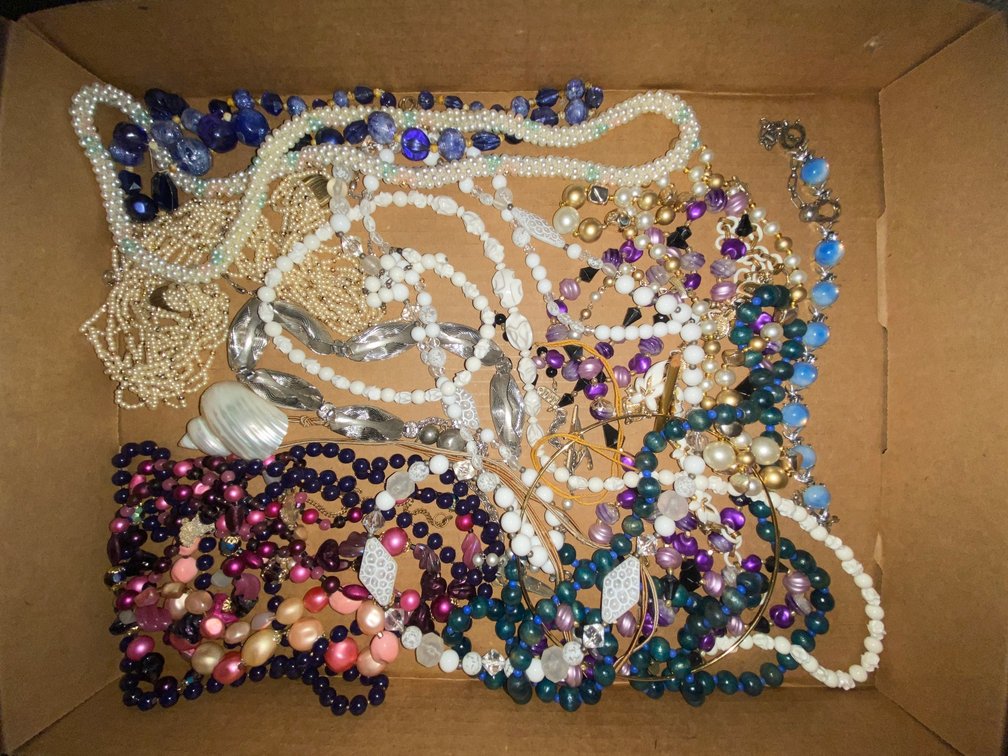 Flat of costume jewelry