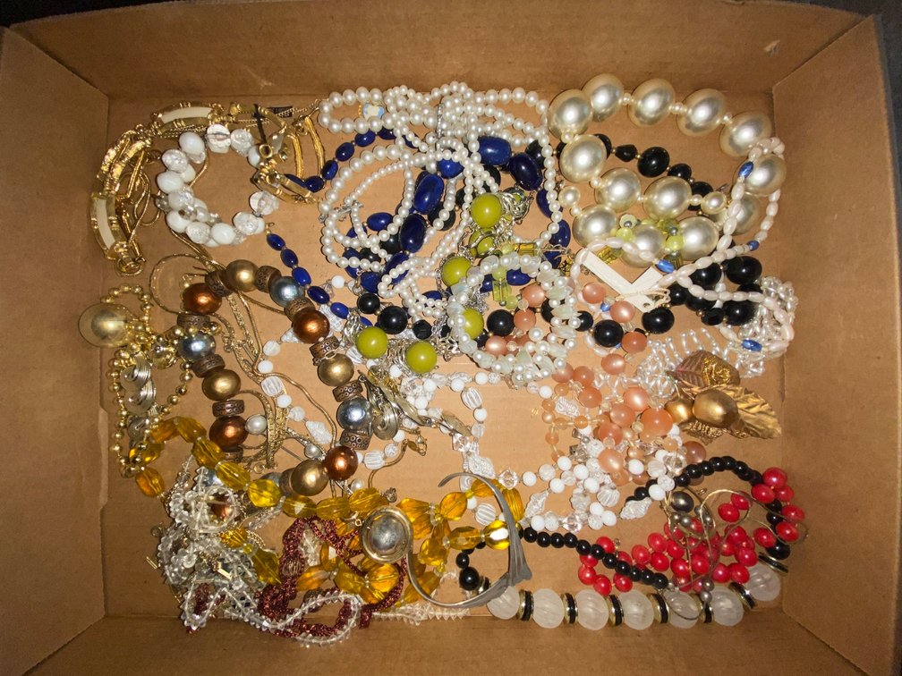 Flat of costume jewelry