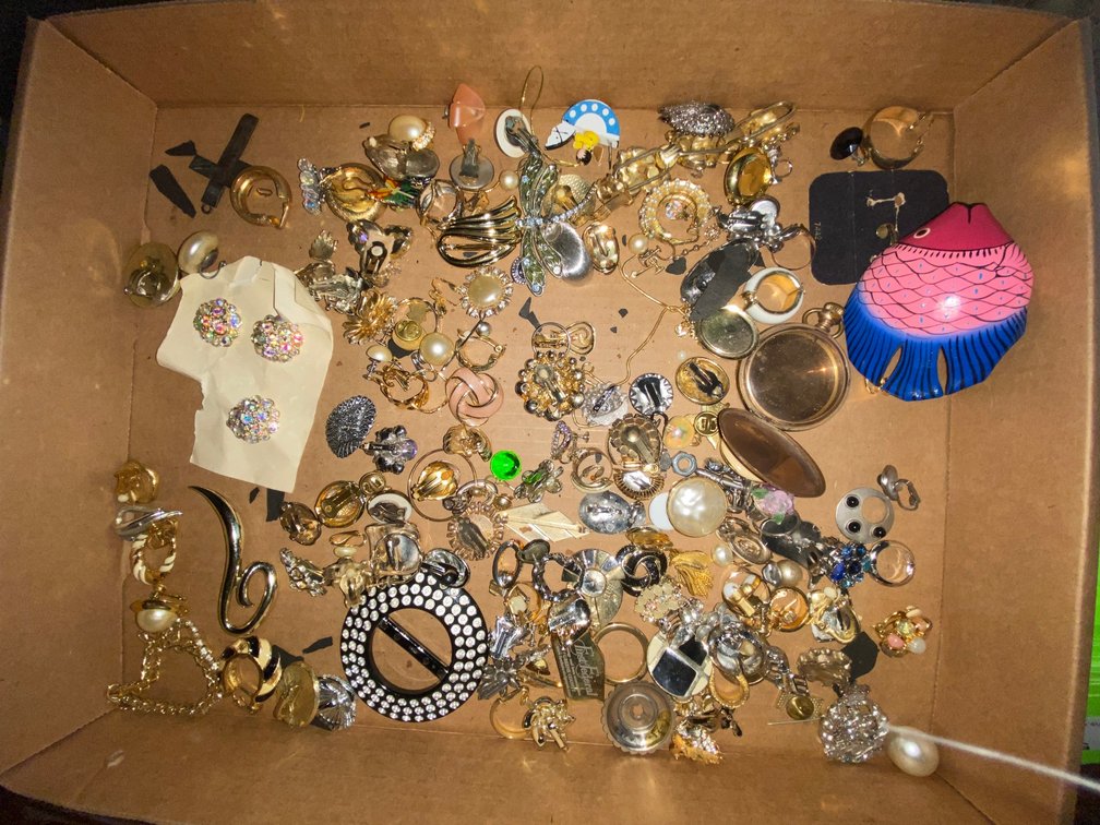 Flat of costume jewelry