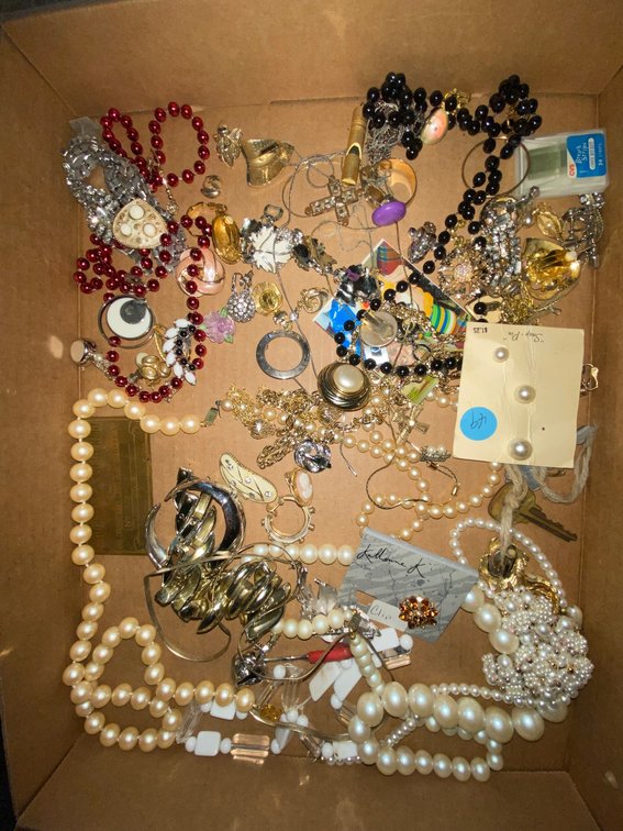 Flat of costume jewelry