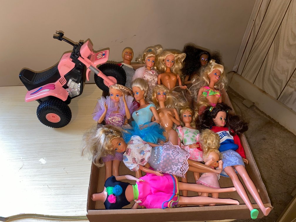 Flat with assortment of Barbies, little trike-one handlebar is broken
