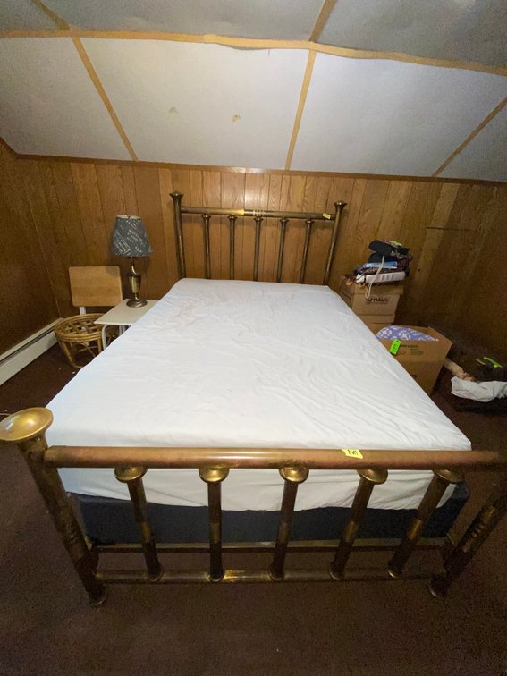 Full size brass bed, mattresses appear to be new