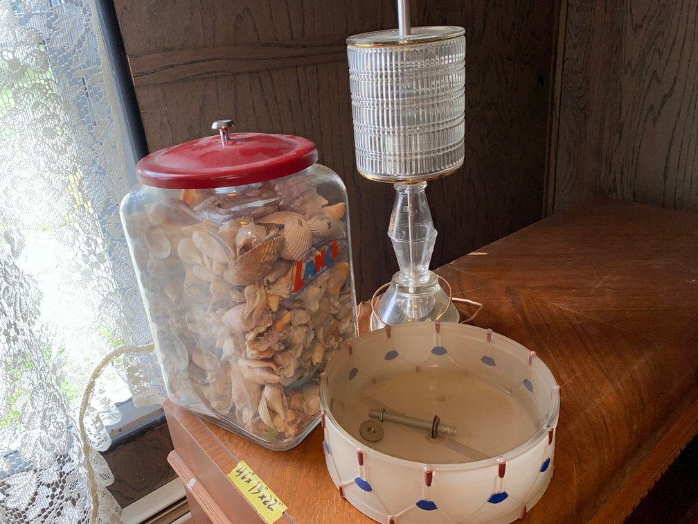 Lance candy jar filled with seashells, lamp shade, table lamp
