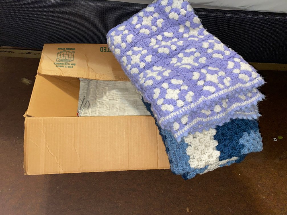Box with afghans, drapes, sheers