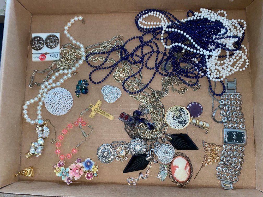 Flat of costume jewelry