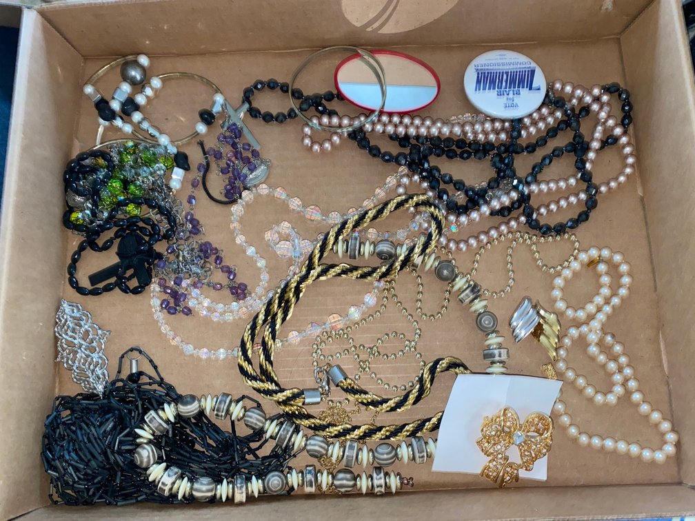 Small flat of costume jewelry