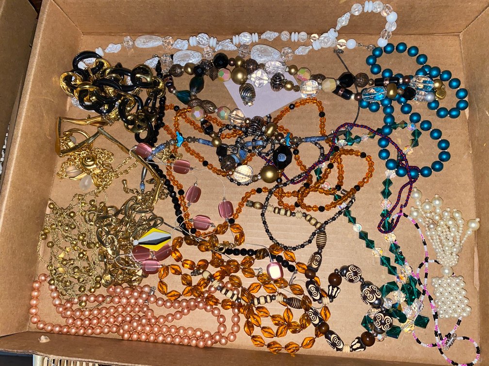 Flat of costume jewelry
