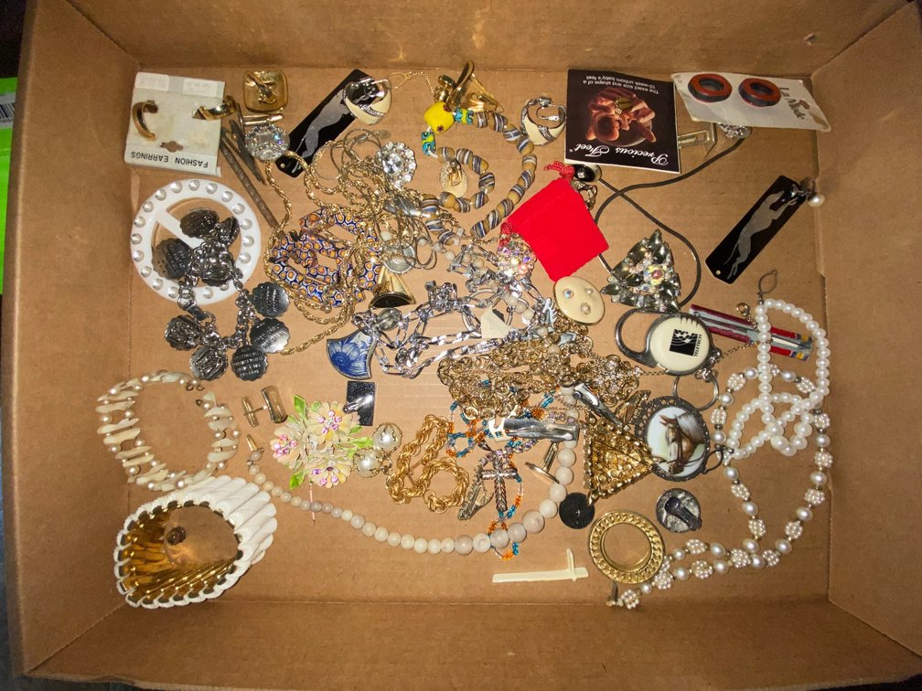 Flat of costume jewelry