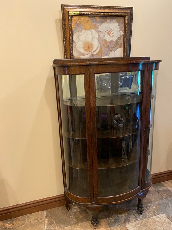 Antique curved glass curio cabinet, framed painting on canvas