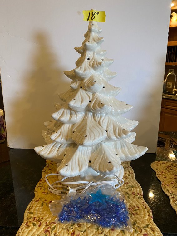 White ceramic Christmas tree with blue lights