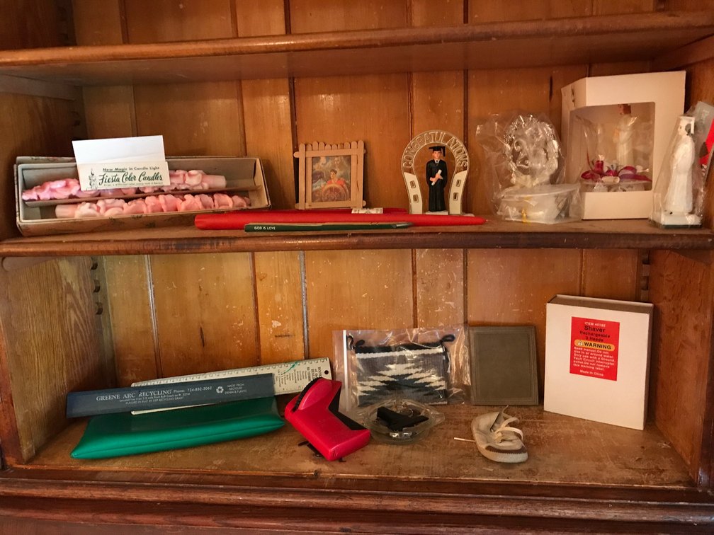 Contents of drop front desk-candles, knickknacks