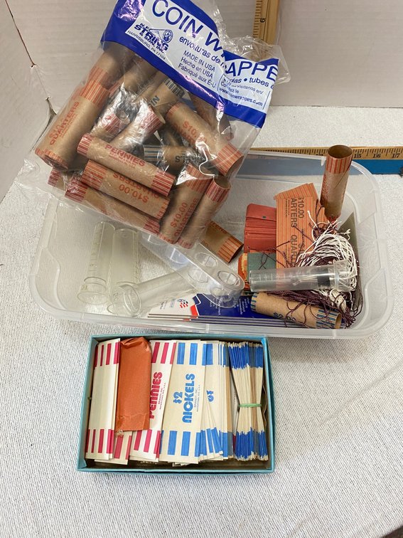Assortment of Empty Coin Rollers and Accessories