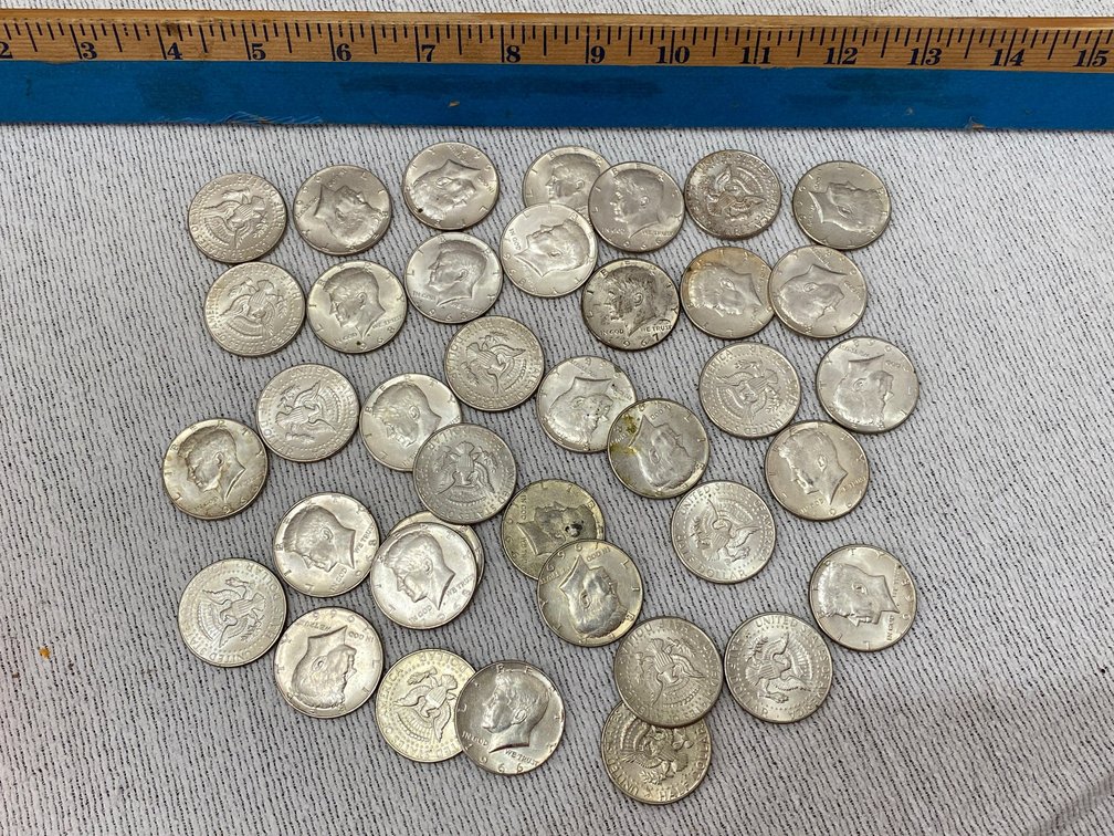38- Kennedy half Dollars