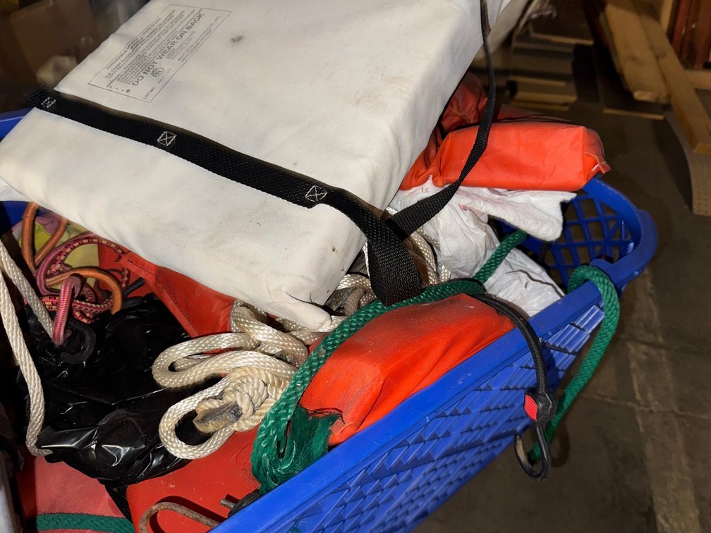 Collection of life jackets and boating supplies