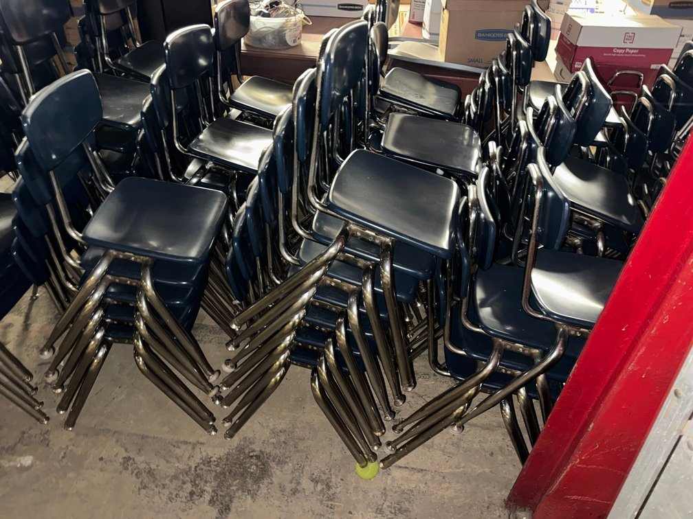 Collection of metal classroom chairs