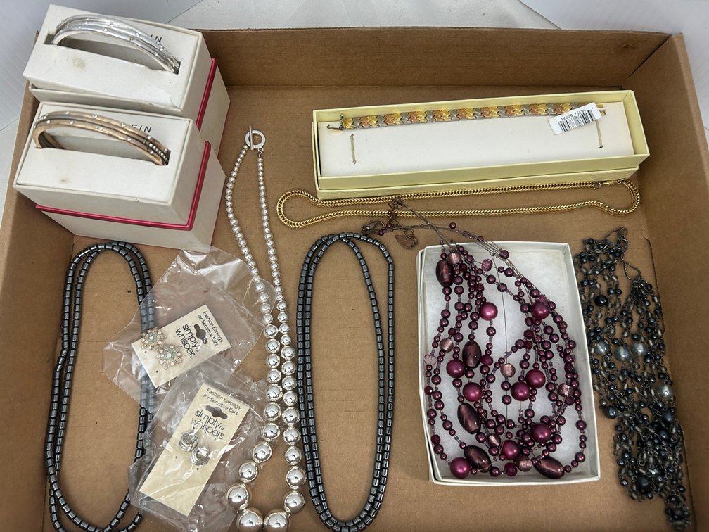 Ladies' costume jewelry including necklaces, earrings, and bracelets