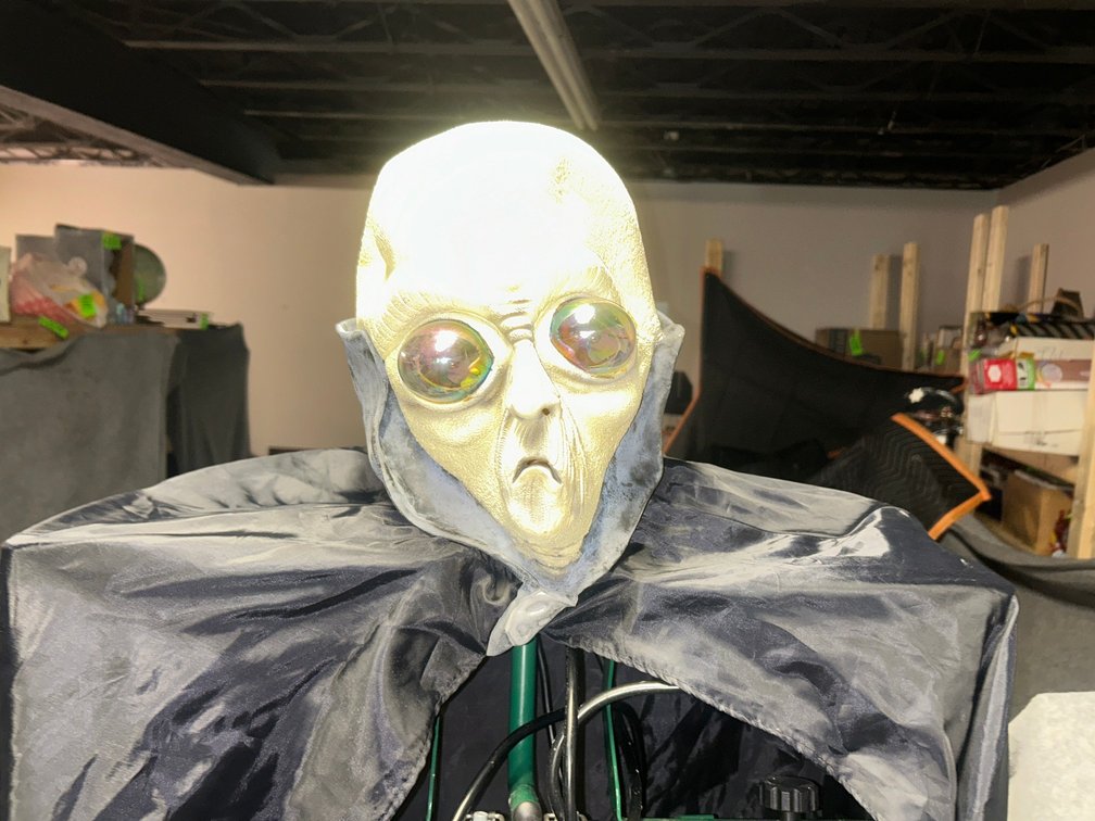 Halloween alien costume including alien face and black robe
