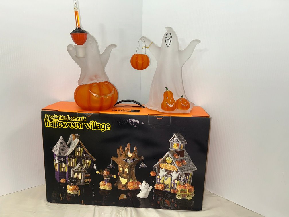 Halloween village with ghost and pumpkins