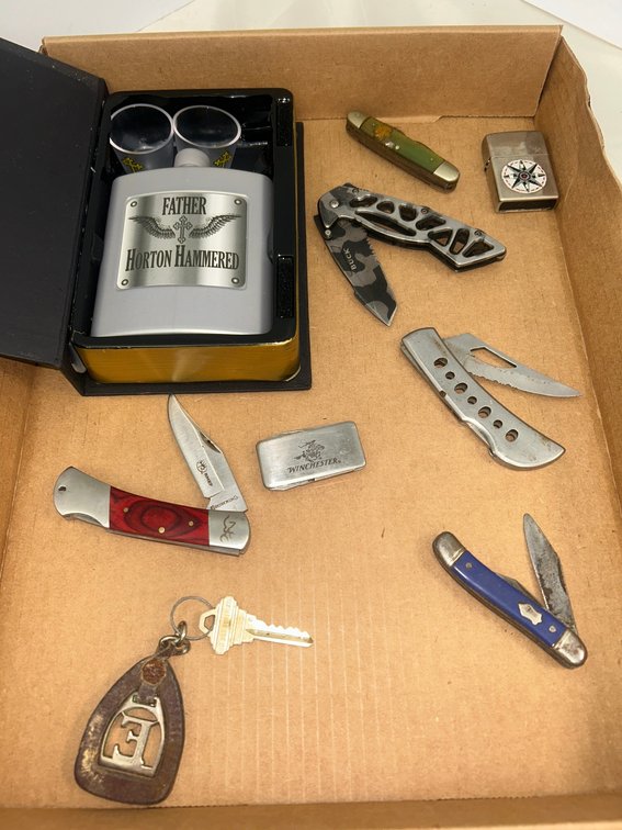 Men's items including pocket knives, lighters, and key fob