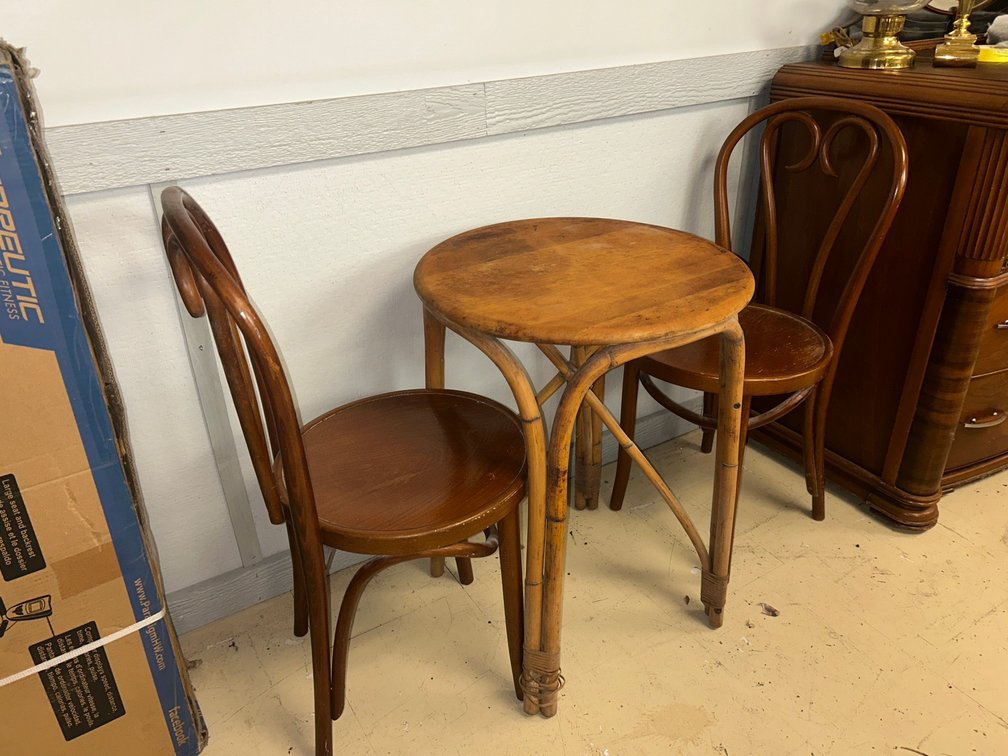 Small round table with two bentwood chairs