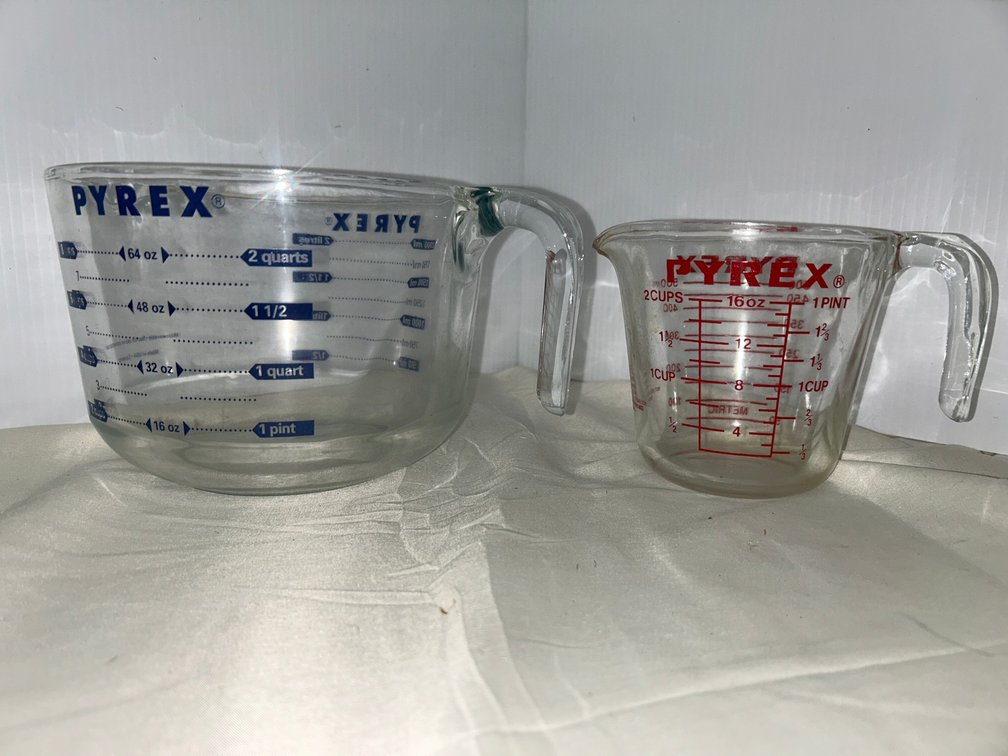 Two Pyrex measuring cups