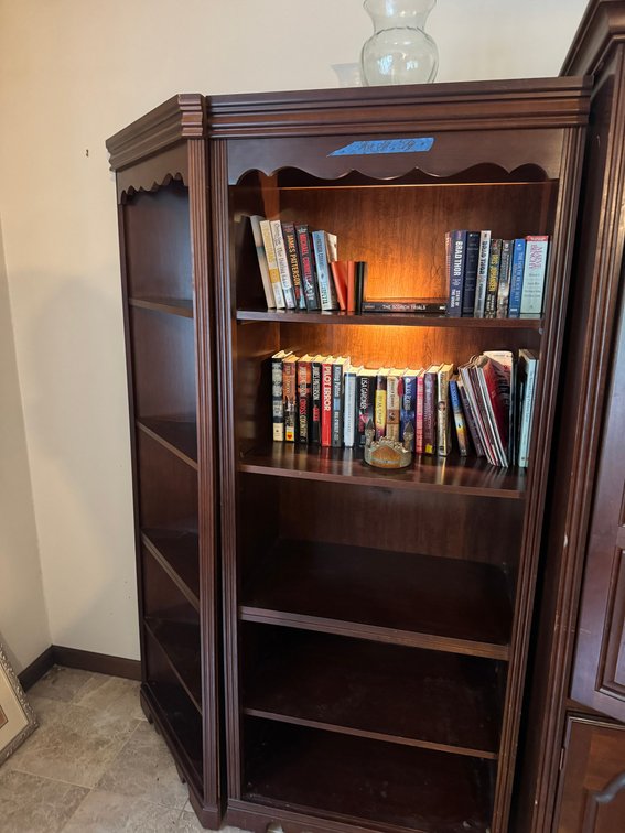 Two Dark Wood Corner Bookcases