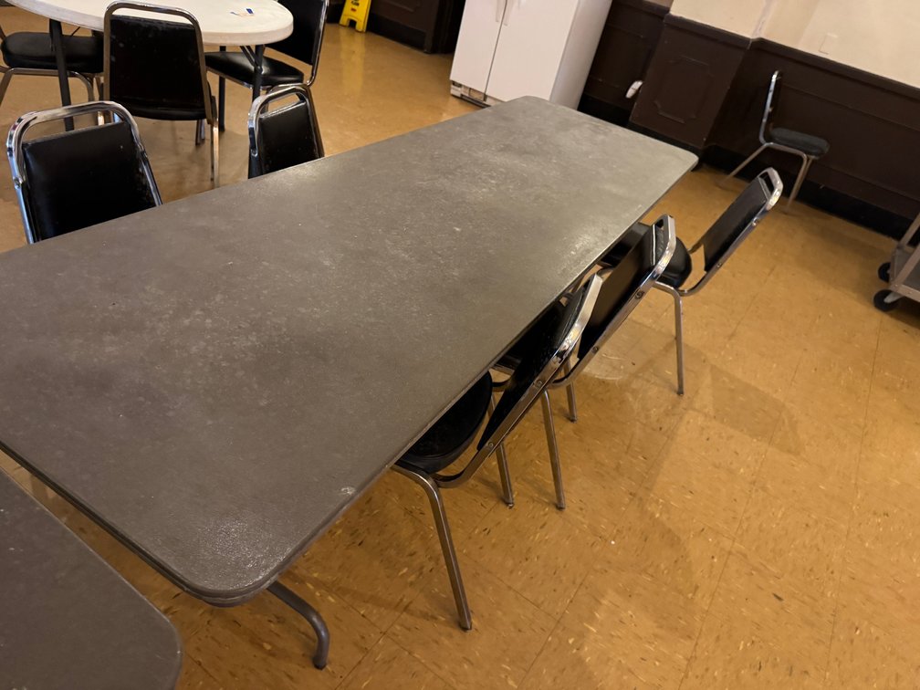 Banquet tables with black chairs