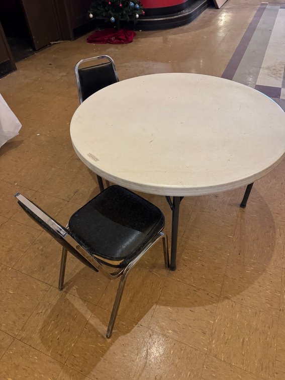 Round banquet tables with black chairs