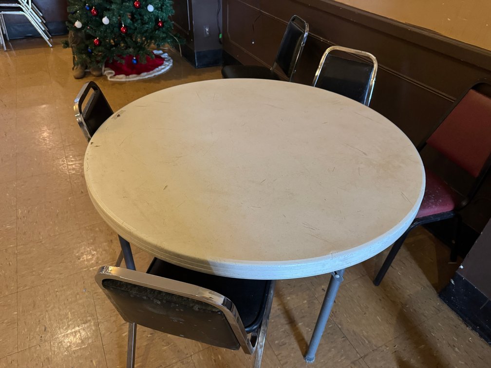 Round banquet tables with black chairs